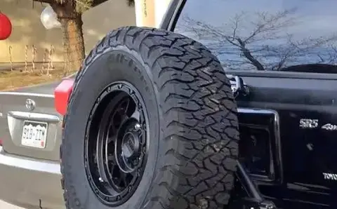 Dirt.com - Trail Swing Tire Holder.