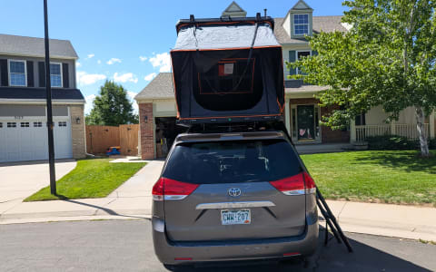 12 Toyota Sienna with Naturnest Rooftop Tent