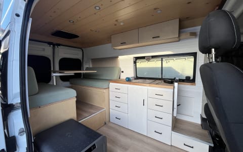 New, bright, clean, custom camper. Roof deck! Benc