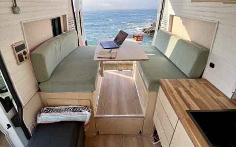 New, bright, clean, custom camper. Roof deck! Benc