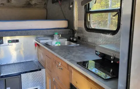 Custom built flatbed camper with aluminum bed